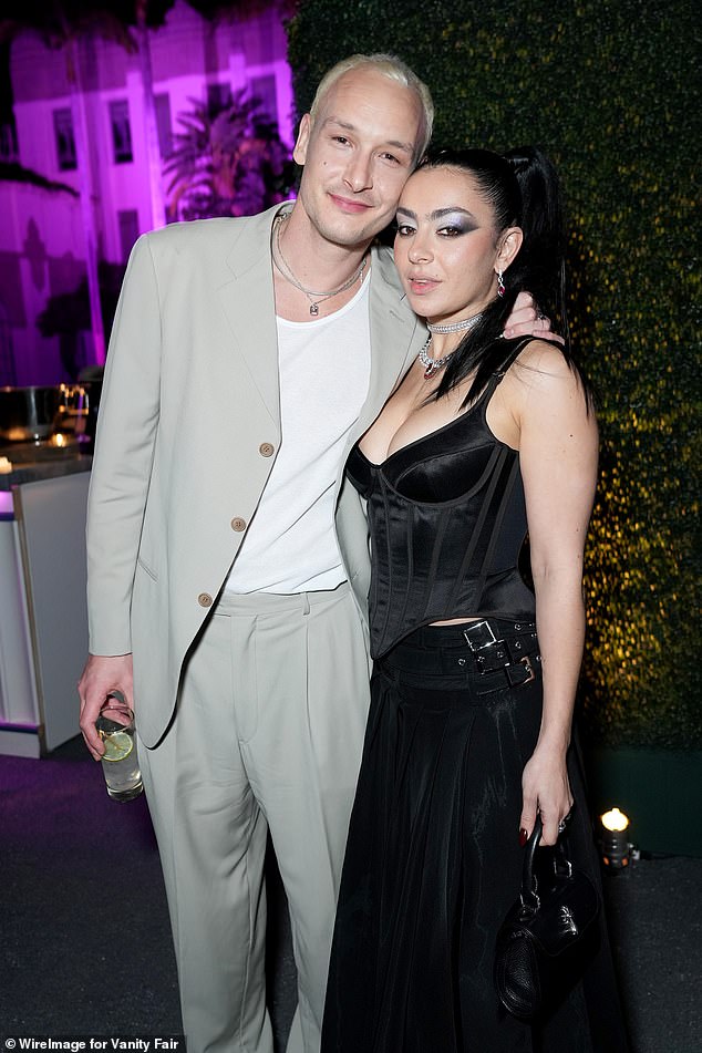 Several fans have taken this to be a direct reference to Taylor who briefly dated The 1975 frontman Matty Healy last year, while Charli is currently engaged to his bandmate, drummer George Daniel (pictured together last year)