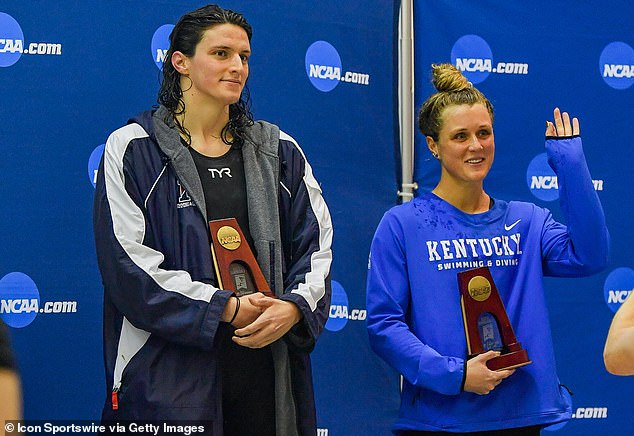 Thomas alongside Kentucky's Riley Gaines after both tied for fifth at the NCAA championships