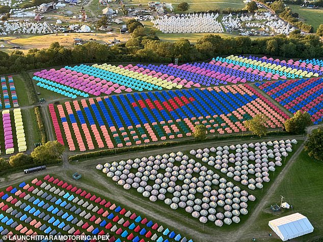 A colourful montage of tents with one area arranged in the shape of a red heart above the numbers of the year 2024