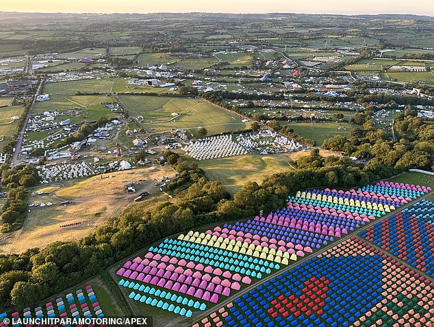 Accommodation tents of variious colours lined up ready for festival goers