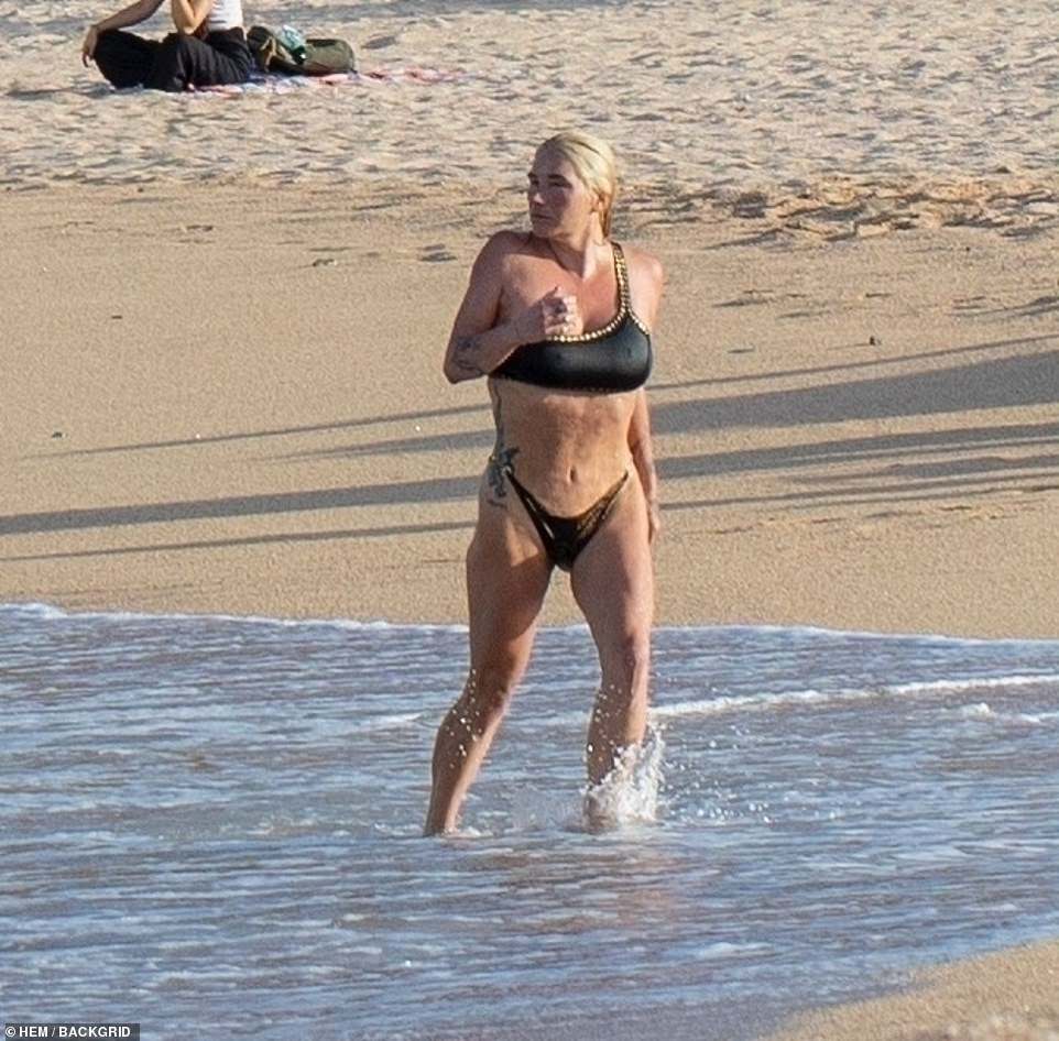 In addition to spending time in the water, Kesha (born Kesha Rose Sebert) spent her time on shore winding down by practicing some yoga