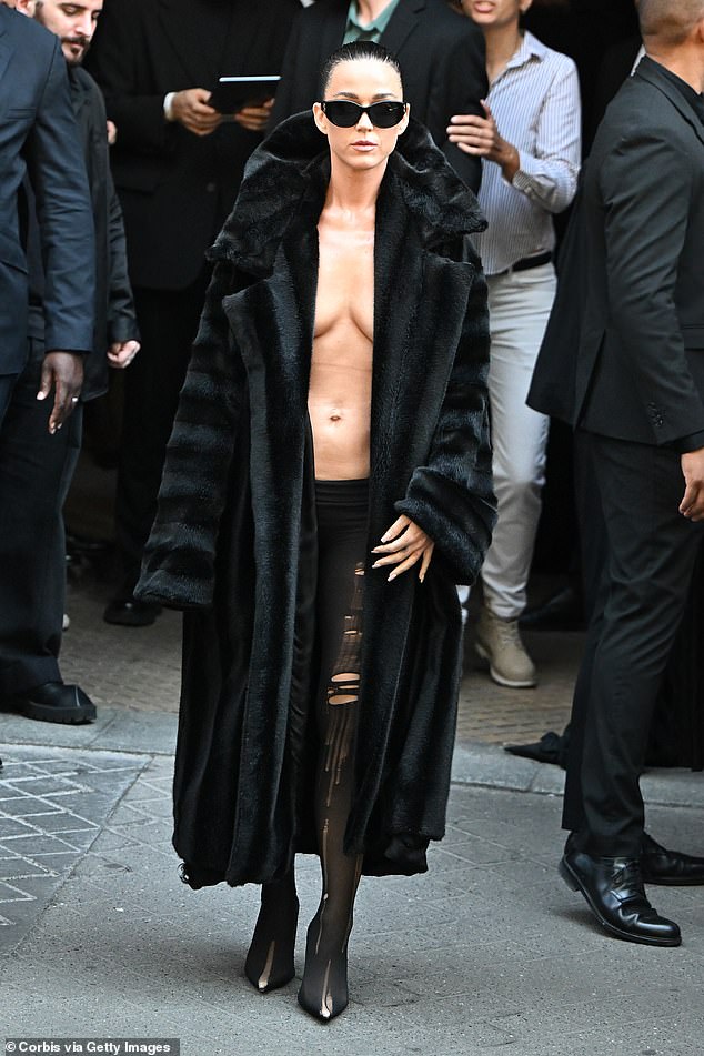 Katy Perry showed off her most daring look yet as she arrived for the show in a perilously plunging fur coat