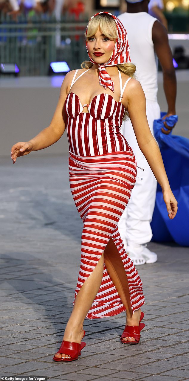 Sabrina Carpenter walked the runway in striped, retro-inspired Jacquemus swimwear with matching headscarf