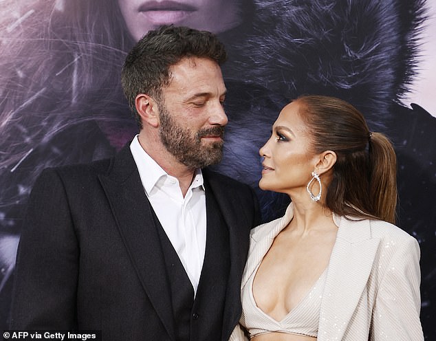 Rumors surrounding a divorce between Ben and Jennifer Lopez (pictured together in May) ramped up this week after he was also spotted without his wedding ring on