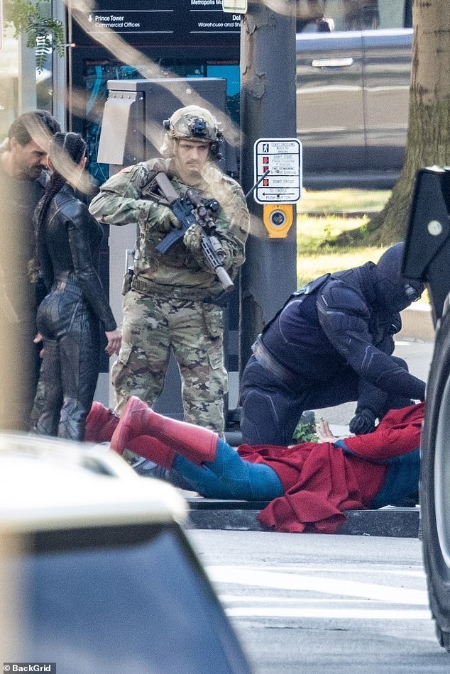 Corenswet was pictured in his full Superman outfit in a scene in which soldiers and a character in a black bodysuit had Superman on the ground, fitting him with restraints as they took him into custody