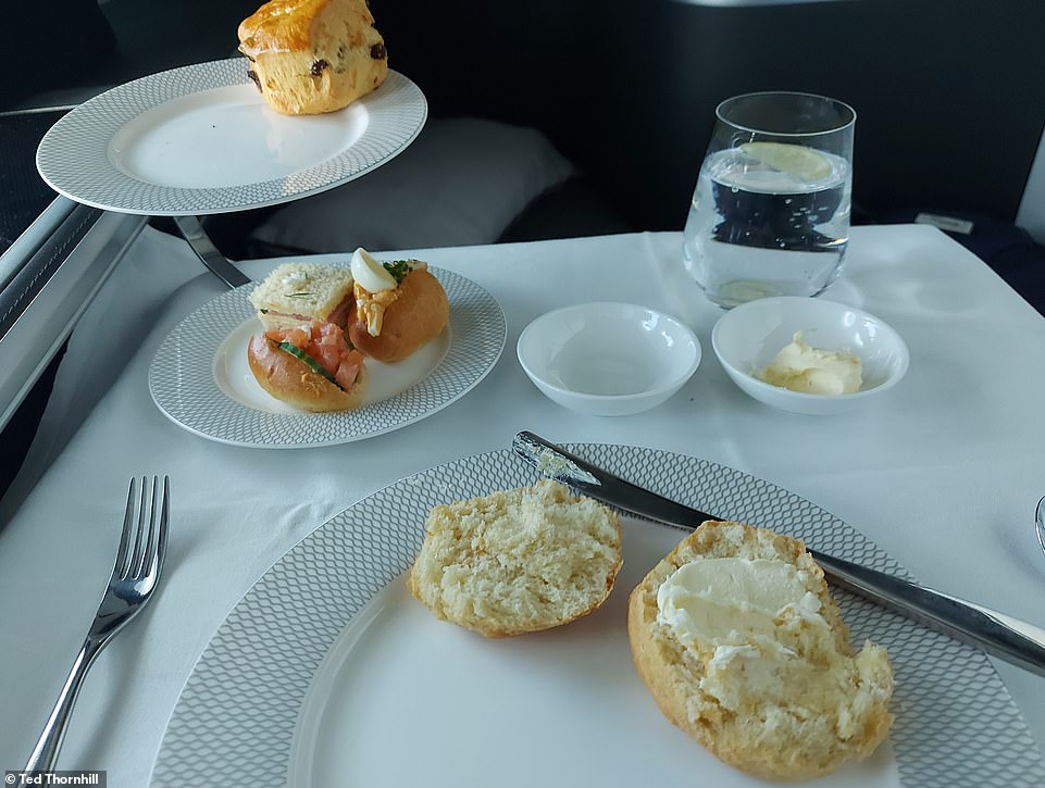 Ted is treated to afternoon tea, with salmon, egg mayonnaise and ham sandwiches; plus scones, served on a silver two-tier stand