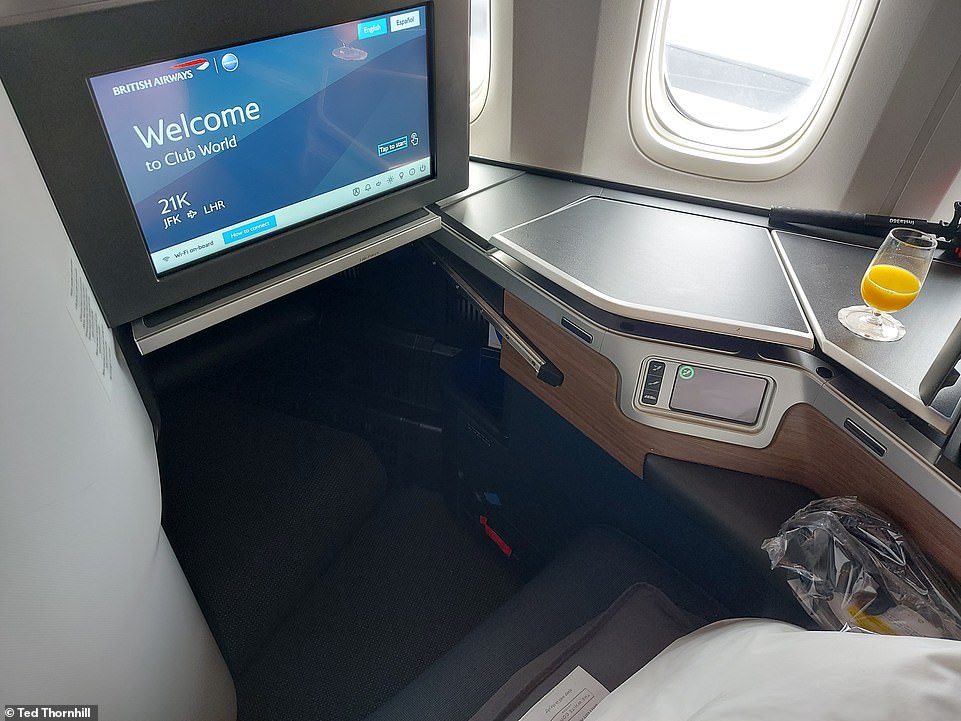 The business class seat 'is pristine, comfortable and supportive and flattens to a six-foot-long bed'