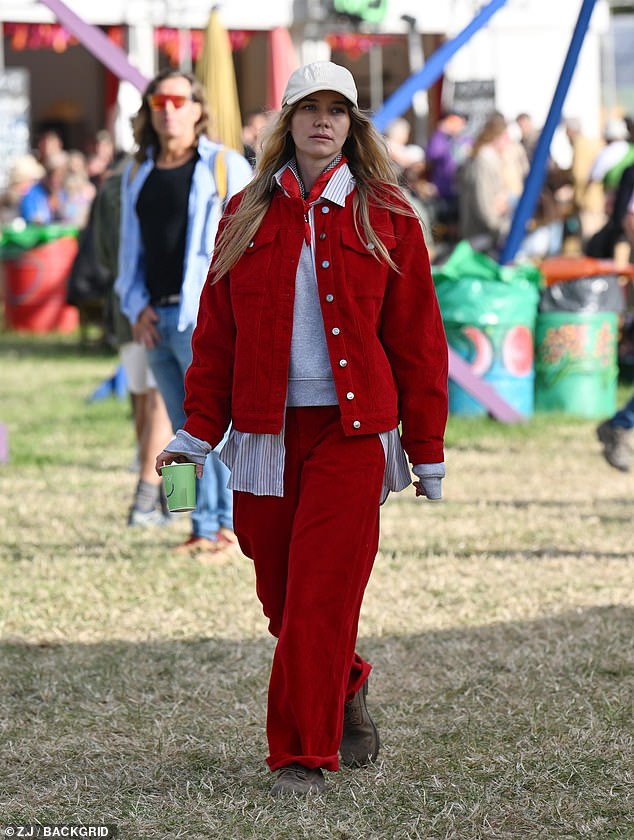 Imi Waterhouse channelled the 70s in a funky red corduroy ensemble, with an oversized striped shirt