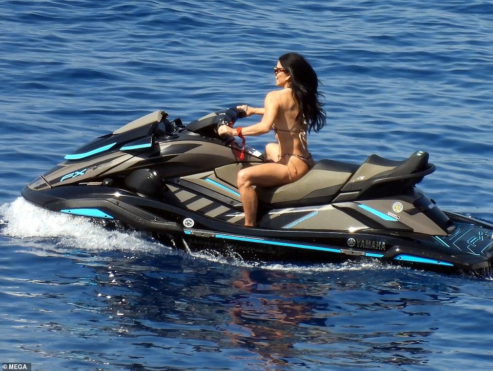 Lauren Sanchez looked every inch the action woman as she rode majestically over the waves on a jet ski in Greece