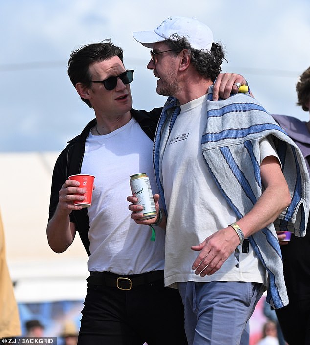 He played it cool in a white T-shirt and open buttoned shirt which he paired with black jeans and accessorised with a skinny belt, necklace and sunglasses