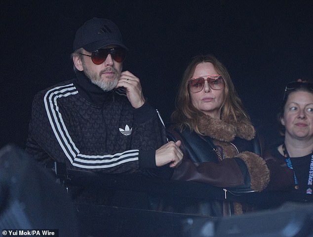 Meanwhile, Stella, 52, and Alasdhair looking unamused as they watched PJ Harvey perform on the Pyramid Stage