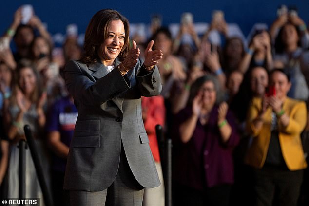 U.S. Vice President Kamala Harris greets her audience on the campaign trail