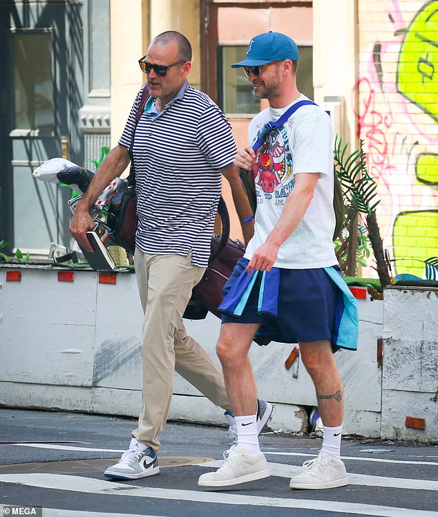 He slipped into a pair of white socks and sneakers that were secured with laces, while a blue cap was placed on top of his head