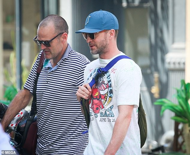 The performer carried a cross-body bag over his left shoulder to hold a few items he needed during the daytime excursion