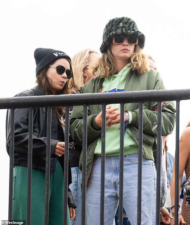 While Minke, whose real name is Leah Mason, cut a typically edgy figure in a black leather jacket and emerald green trousers