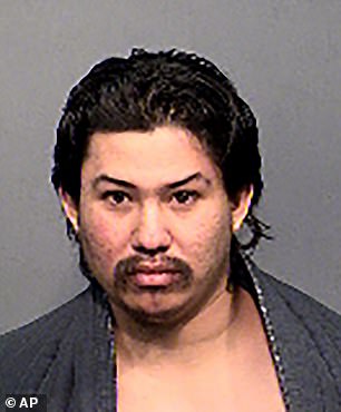 This undated booking photo provided by the Flagstaff Police Department shows Martinez