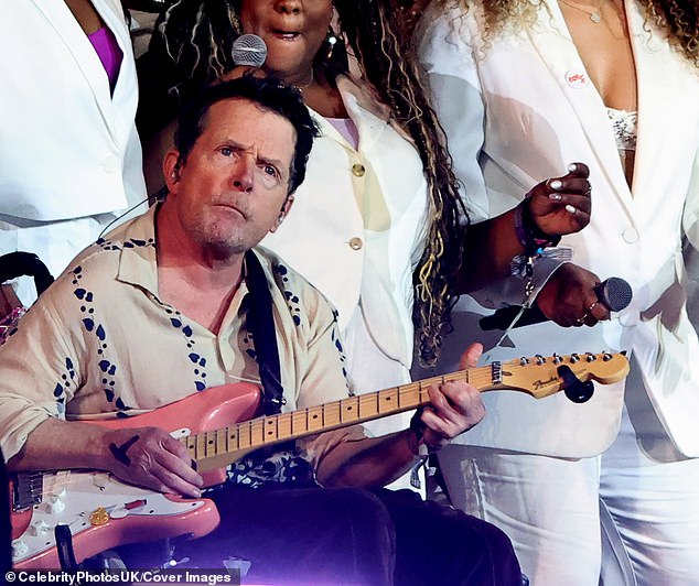 Michael J Fox, who has Parkinson's Disease, pictured above on stage with Coldplay at Glastonbury, UK, this weekend