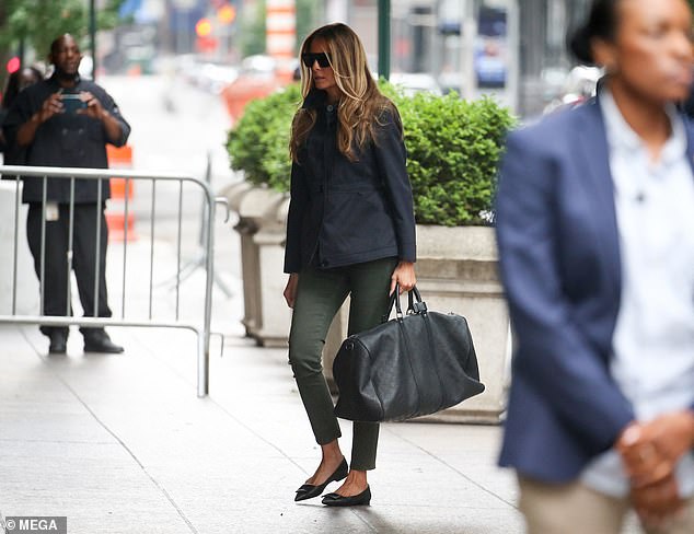 She carried a black Louis Vuitton bag