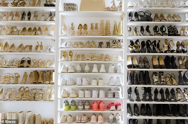 You can see each pair of shoe she owns on the luxe-looking shoe racks that are built into her closet wall