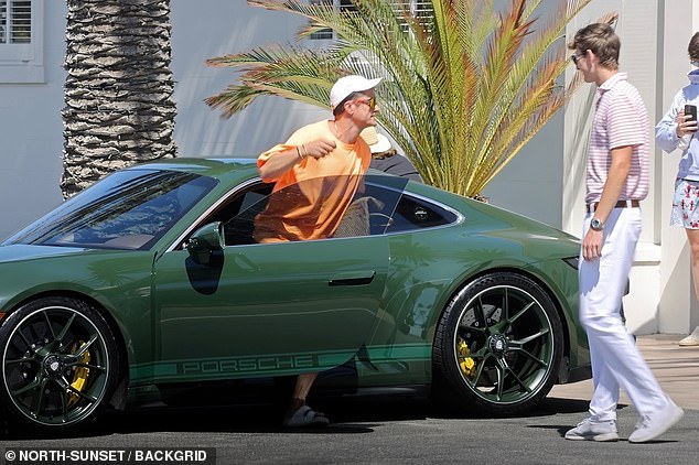 The actor also showed off his new green Porsche car