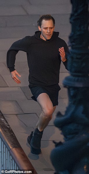 Tom cut a casual figure for the shoot as he was dressed in a black hoodie with matching shorts and trainers