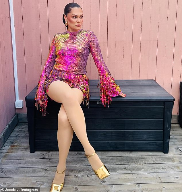 Dressed in an eye-catching sparkly pink and gold sequin dress, Jessie - who is a mother to son Sky, 14 months - posed for a home shoot as she sat on a garden storage box