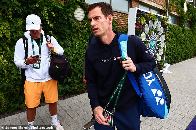 Andy Murray leaves the All England Club today after pulling out of the singles at Wimbledon