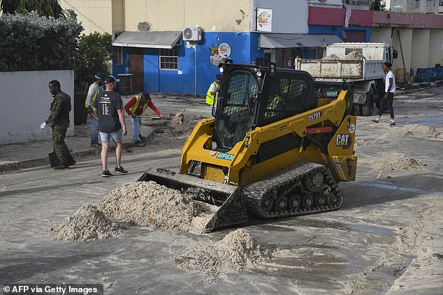 Current models put the 165mph super storm on a track toward Mexico 's Yucatan Peninsula by late Thursday. Pictured: Sand is cleared from the south coast of Barbados on Monday, July 1