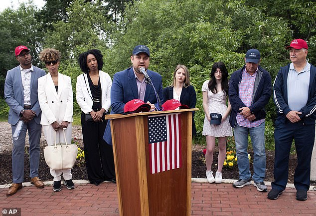 Brett Eagelson (center) whose father was killed on 9/11 has slammed the presidential hopefuls for failing to address the footage