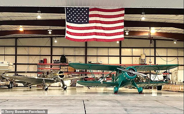 The 1934 WACO YKC single-engine biplane (right) crashed under 'unknown circumstances' then caught fire in a Kansas field