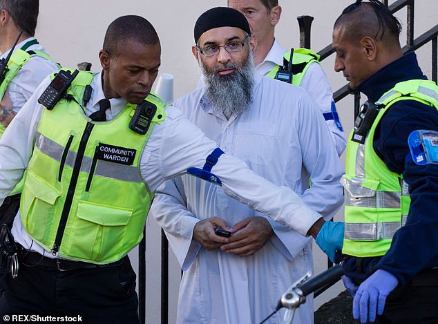 The preacher pictured outside a hostel he was staying in under strict licence conditions after his release from prison in 2018 following a conviction of inviting support for ISIS