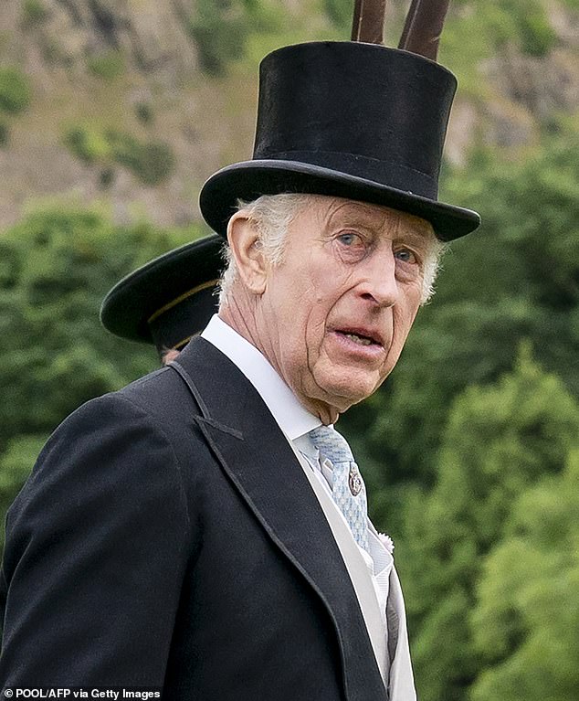 Charles looked dapper in a top hat and morning suit at the Palace of Holyroodhouse in Edinburgh