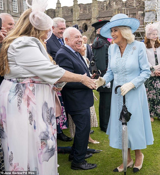 The 76-year-old royal appeared cheerful as she greeted guests lined to meet her at the Palace of Holyroodhouse