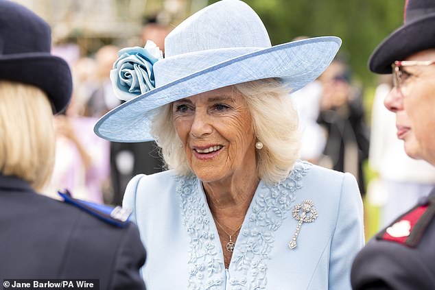 Camilla was elegant in a turquoise Fiona Clare dress with a Philip Treacy hat and one of the late Queen's brooches