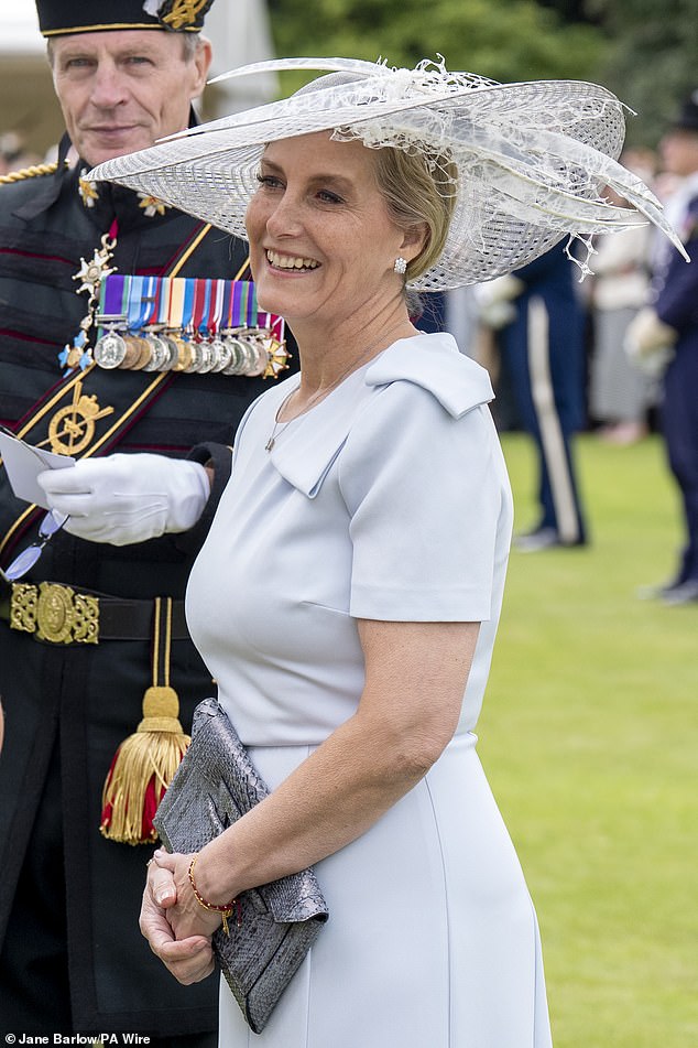 The glamorous mother-of-two, 59, added metallic silver clutch bag to complete her ensemble