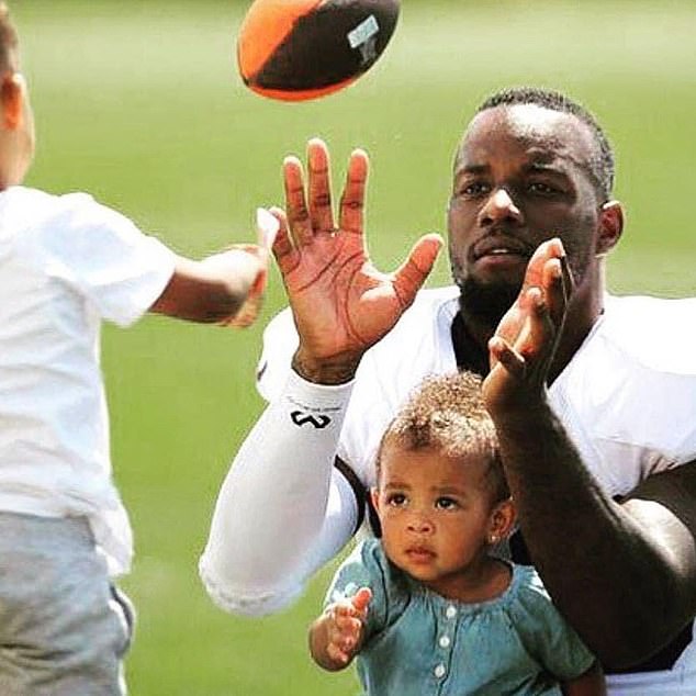 Tashaun Gibson, pictured playing football with his kids, has been suspended for PED use