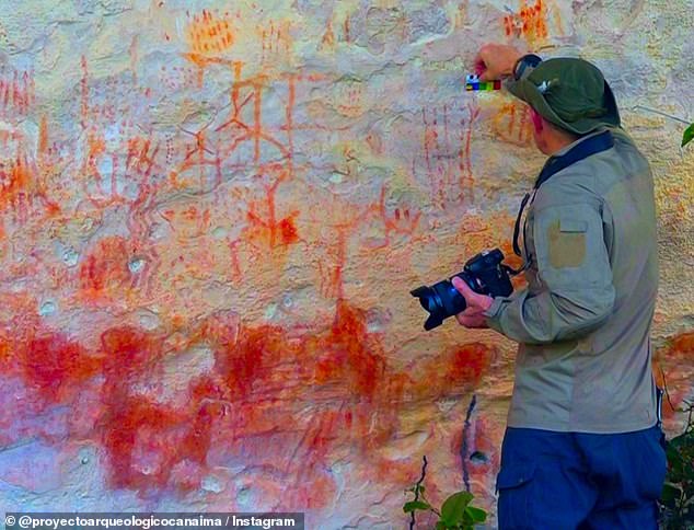 The artwork featured stick figure drawings of people, dot patterns and distinct leaf motifs on a rock wall that might have been used as both a shelter for indigenous hunter-gatherers and the site for enacting ritual activities