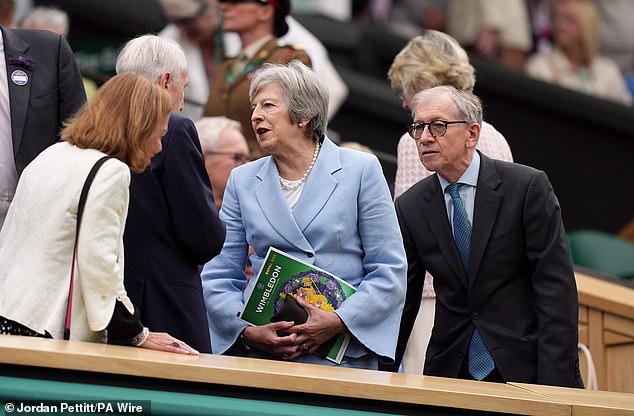 Former British Prime Minister Theresa May attended Wimbledon with her husband Philip (both pictured) today