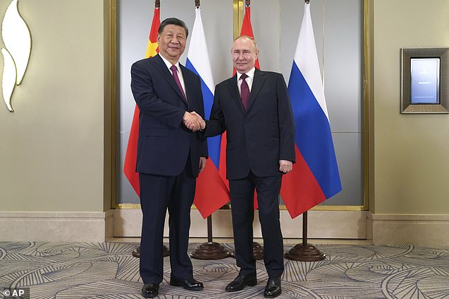 Xi Jinping (left) referred to Putin (right) as his 'old friend' ahead of the summit on Wednesday