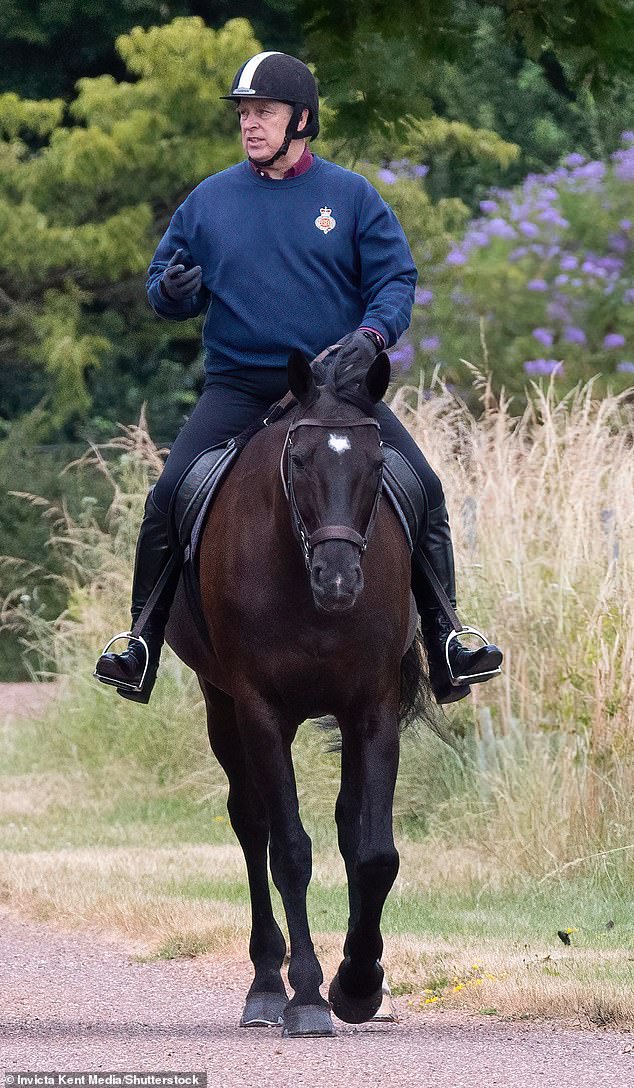 The father of Princess Beatrice and Princess Eugenie appeared focused on the task, sporting a helmet and gloves