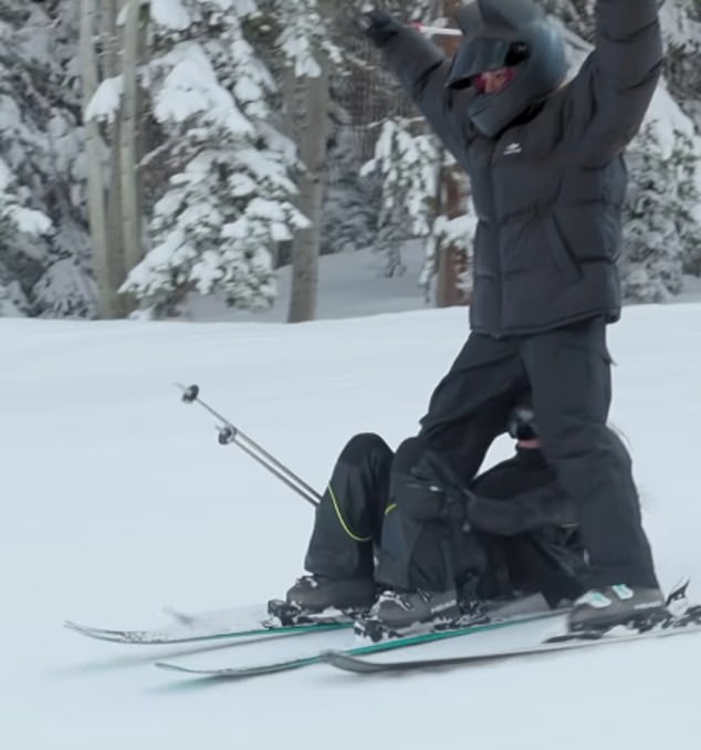 Khloe spreads her skis out wide as Kim gets down and skis right under her sister with ease, though it appears she may have been close to taking a tumble shortly after.