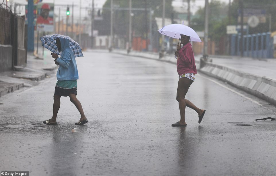 In an ensuing social media post, Prime Minister Holness revealed that nearly 500 Jamaicans had been placed in shelters. 'We are placing emphasis on ensuring they are comfortable and well looked after,' he said. Earlier in the day, as churning whitecaps brought by Beryl¿s eye scraped by the island¿s southern coast, Jon Porter, chief meteorologist at AccuWeather, issued a statement citing the dangerous nature of the storm 'We are very concerned about a wide variety of life threatening impacts in Jamaica,¿ he said, before branding Beryl 'the strongest and most dangerous hurricane threat that Jamaica has faced, probably, in decades.' As a result Jamaica was under a state of emergency, and afterward was declared a disaster zone hours before the impact. Holness says the disaster zone declaration will remain for the next seven days, as he implemented an island-wide curfew. The hours for the restrictions were between 6 am and 6 pm, and were in effect only Wednesday. The curfew has since passed, with officials now surveying the damage.