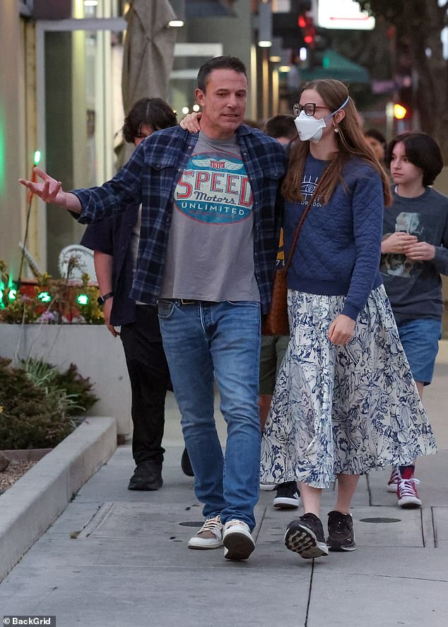 The actor was casually dressed in a plaid shirt, grey T-shirt and jeans, while Violet opted for a navy jumper and white and blue patterned skirt