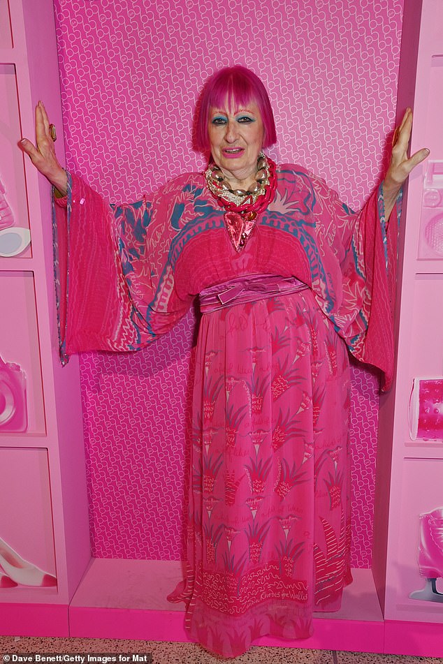 Zandra Rhodes commanded attention at the star-studded event as stepped out in dazzling pink holiday dress and blue eyeshadow