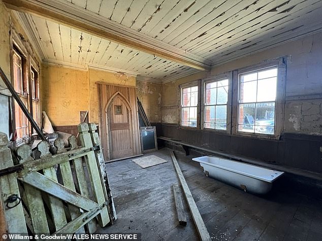 The red and white brick station, nestled next to a tunnel, is in need of modernisation but could now be turned into a home. Pictured: One of the station's rooms in need of renovation