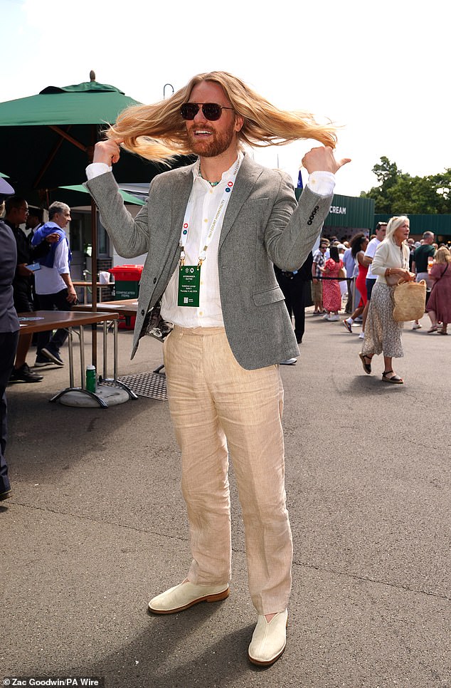 He flicked his long hair around as he arrived at the tennis event