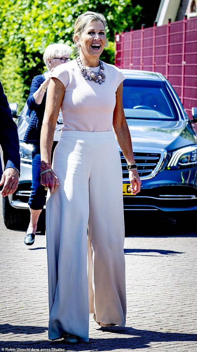 Queen Máxima of the Netherlands (pictured) achieved a look that was at once glamourous and relaxed with a pale pink top accessorised with a dramatic floral necklace in complementary colours