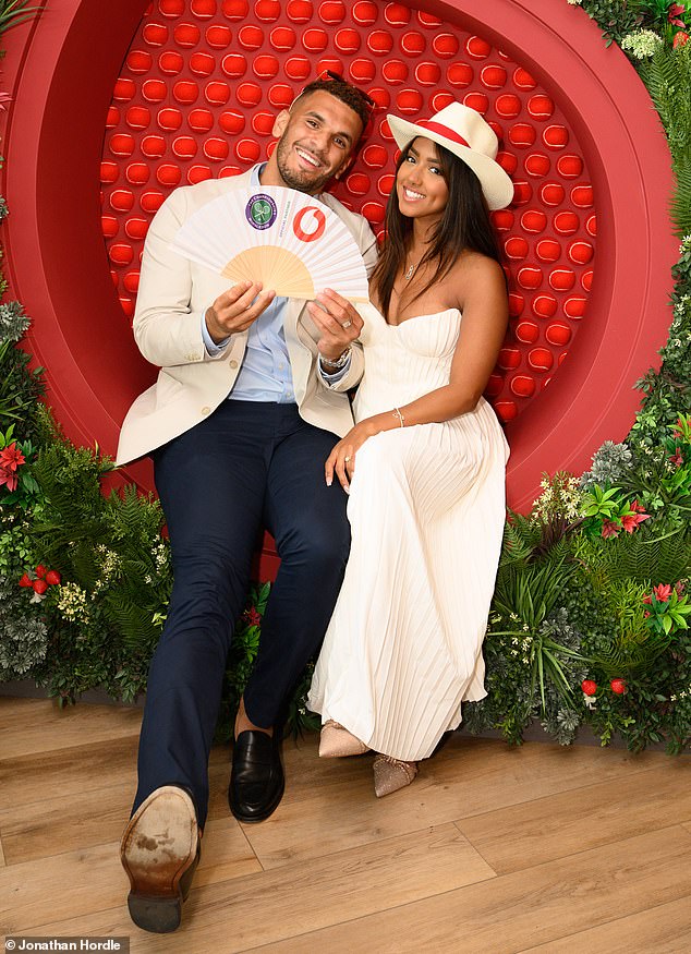 Sanam embraced the tournament's white them as she arrived in a pleated, corseted strapless gown and a floppy hat, which she paired with nude stilettos.