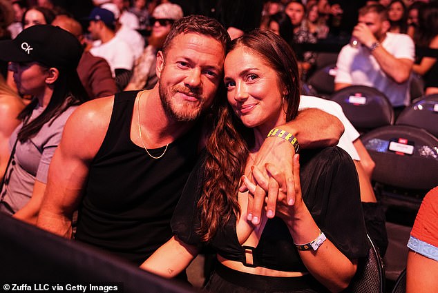 Dan Reynolds, 36, gushed about his nearly two-year relationship with actress, Minka Kelly, 44, and sweetly said they've been 'attached at the hip' since their romance began; seen in June in Las Vegas