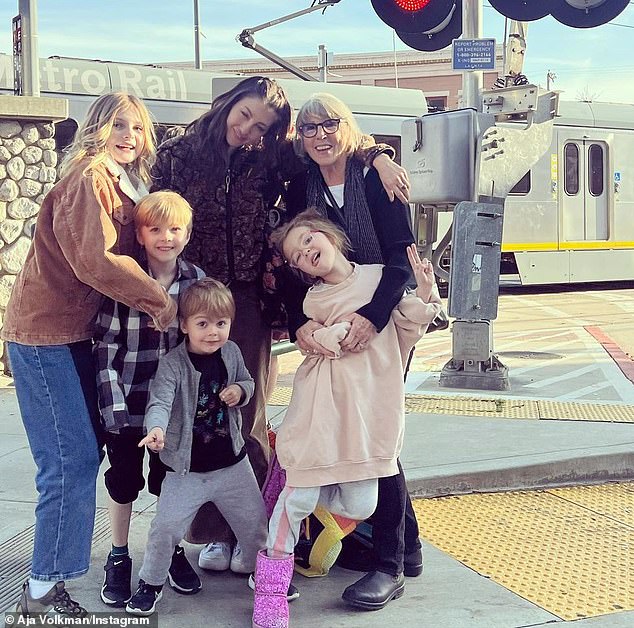 '[Fatherhood] is my favorite part of life. It brings me immense joy. I count myself really lucky that I have an incredible co-parent,' Dan said; Aja seen above with their four children